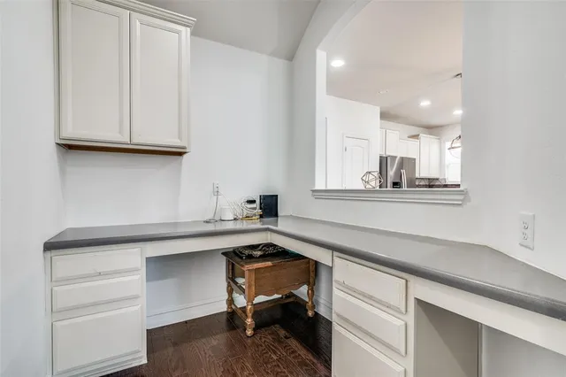 a kitchen with a sink cabinets and a window