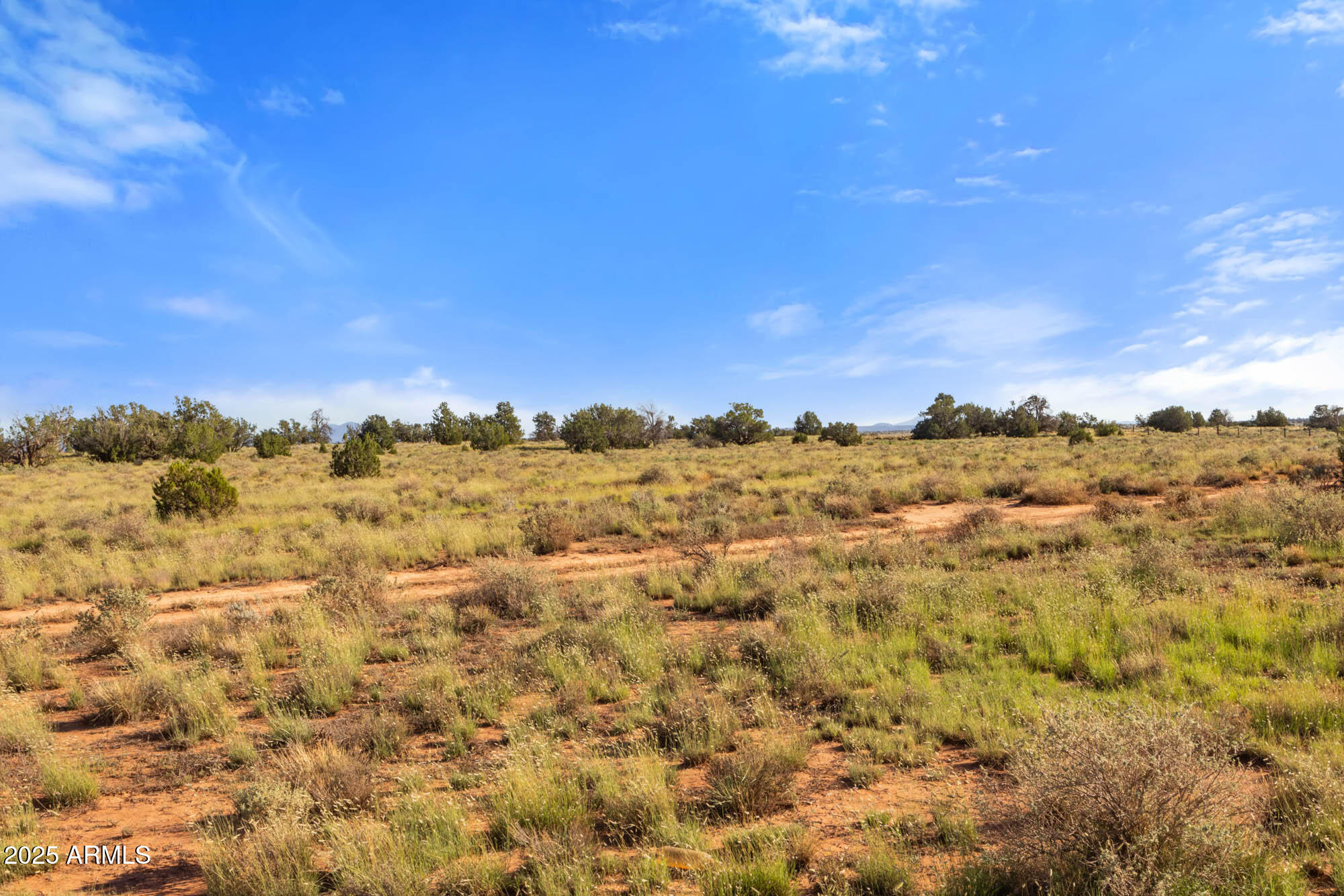 749 North Northland Road, Unit 12 Williams, AZ 86046 - Photo 6 of 15 a view of a large building with mountains in the background