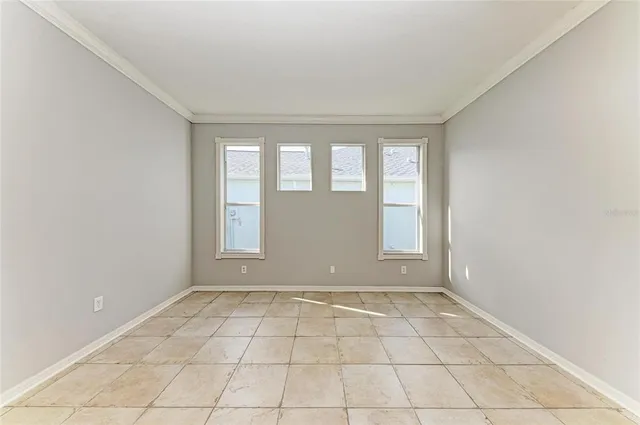a view of an empty room with a window