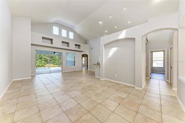 a view of a kitchen with a sink and a large mirror