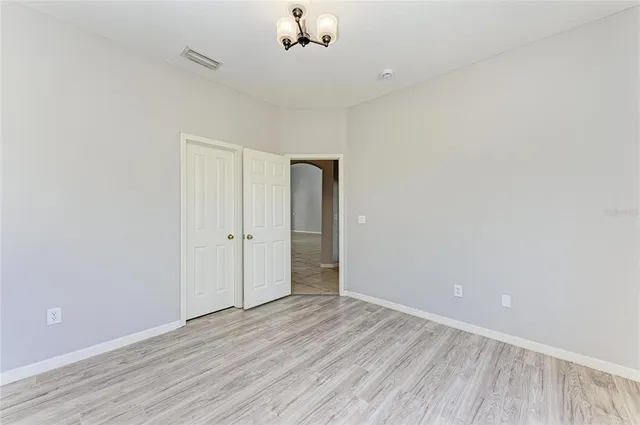 a view of empty room with floor to ceiling window