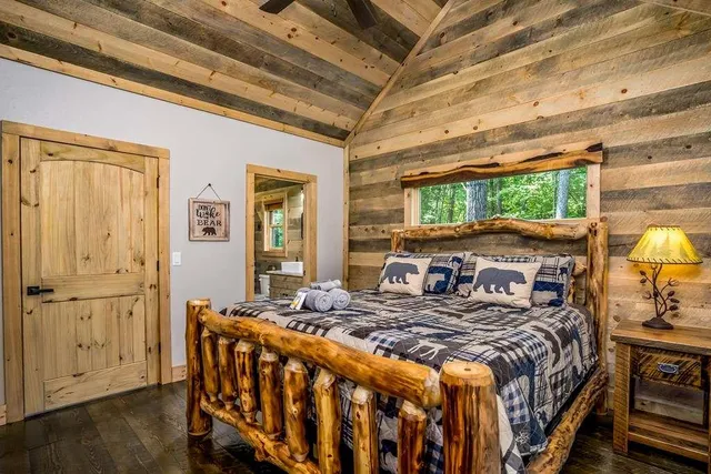 a bathroom with a double vanity sink a mirror and next to a window