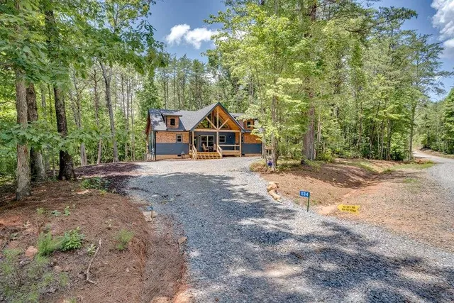 a view of a patio with wooden floor and outdoor seating