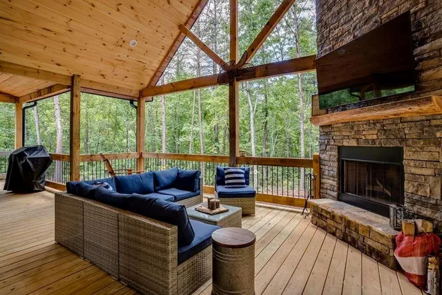 a bedroom with furniture and a fireplace