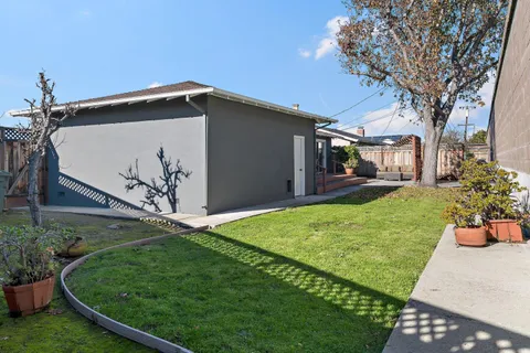 a backyard of a house with lots of green space