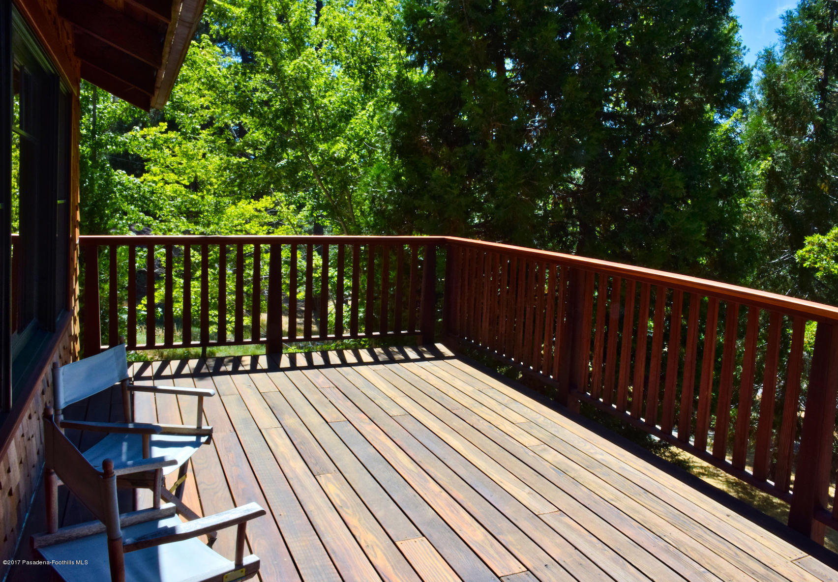 53225 Tollgate Road Idyllwild, CA 92549 - Photo 19 of 24 a balcony with wooden floor and fence