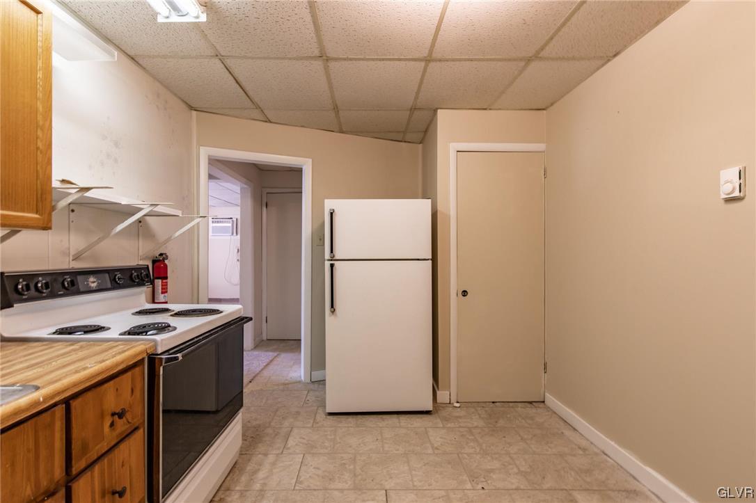 214 West Ridge Street Lansford, PA 18232 - Photo 15 of 26 a kitchen with a refrigerator and a stove