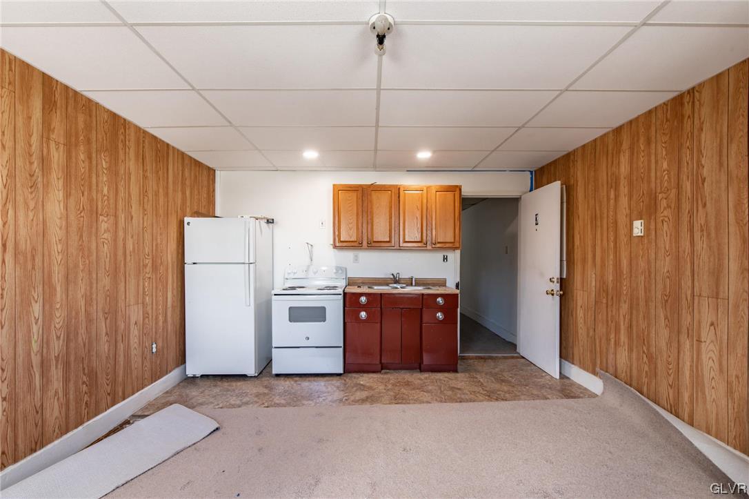 214 West Ridge Street Lansford, PA 18232 - Photo 18 of 26 a view of kitchen with refrigerator cabinets and furniture
