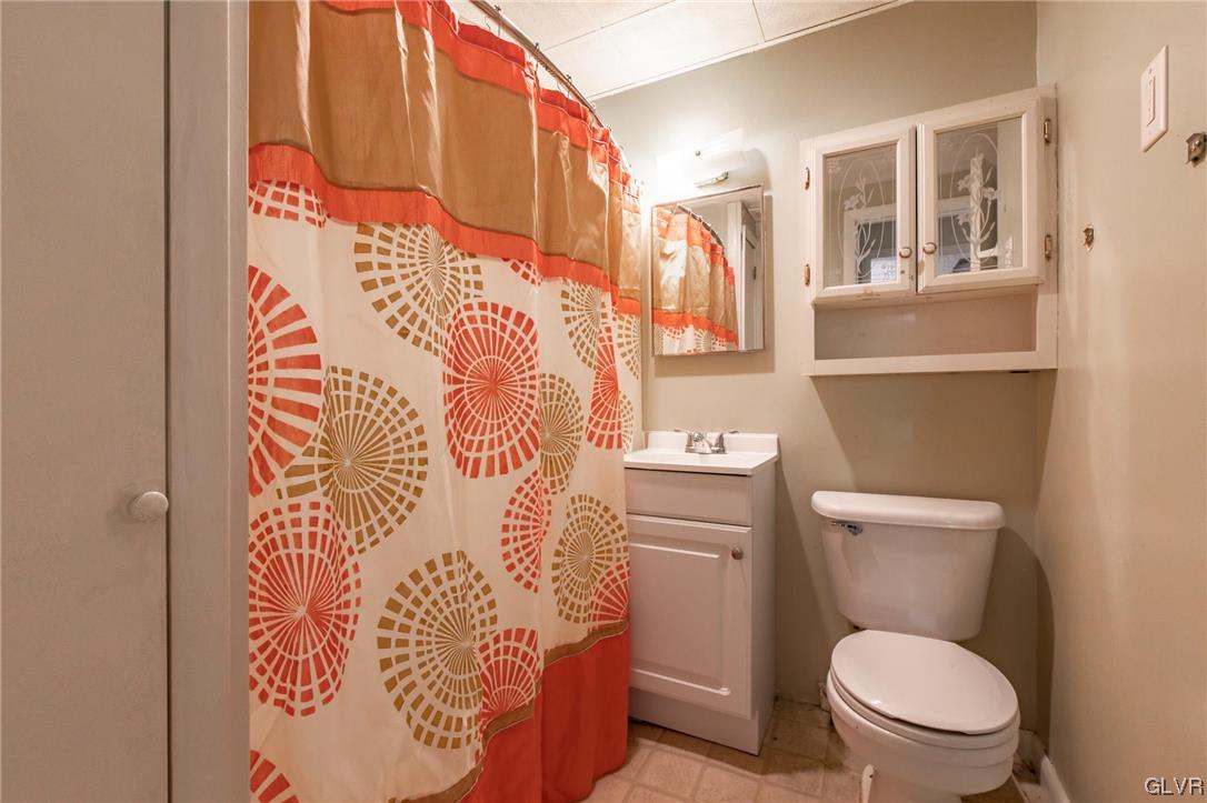 214 West Ridge Street Lansford, PA 18232 - Photo 6 of 26 a white toilet sitting next to a bathroom sink
