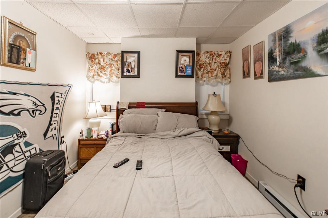 214 West Ridge Street Lansford, PA 18232 - Photo 8 of 26 a bedroom with a bed and wall painting