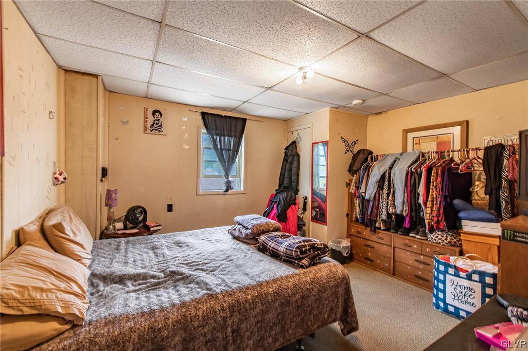 214 West Ridge Street Lansford, PA 18232 - Photo 9 of 26 a bedroom with a bed and a walk in closet