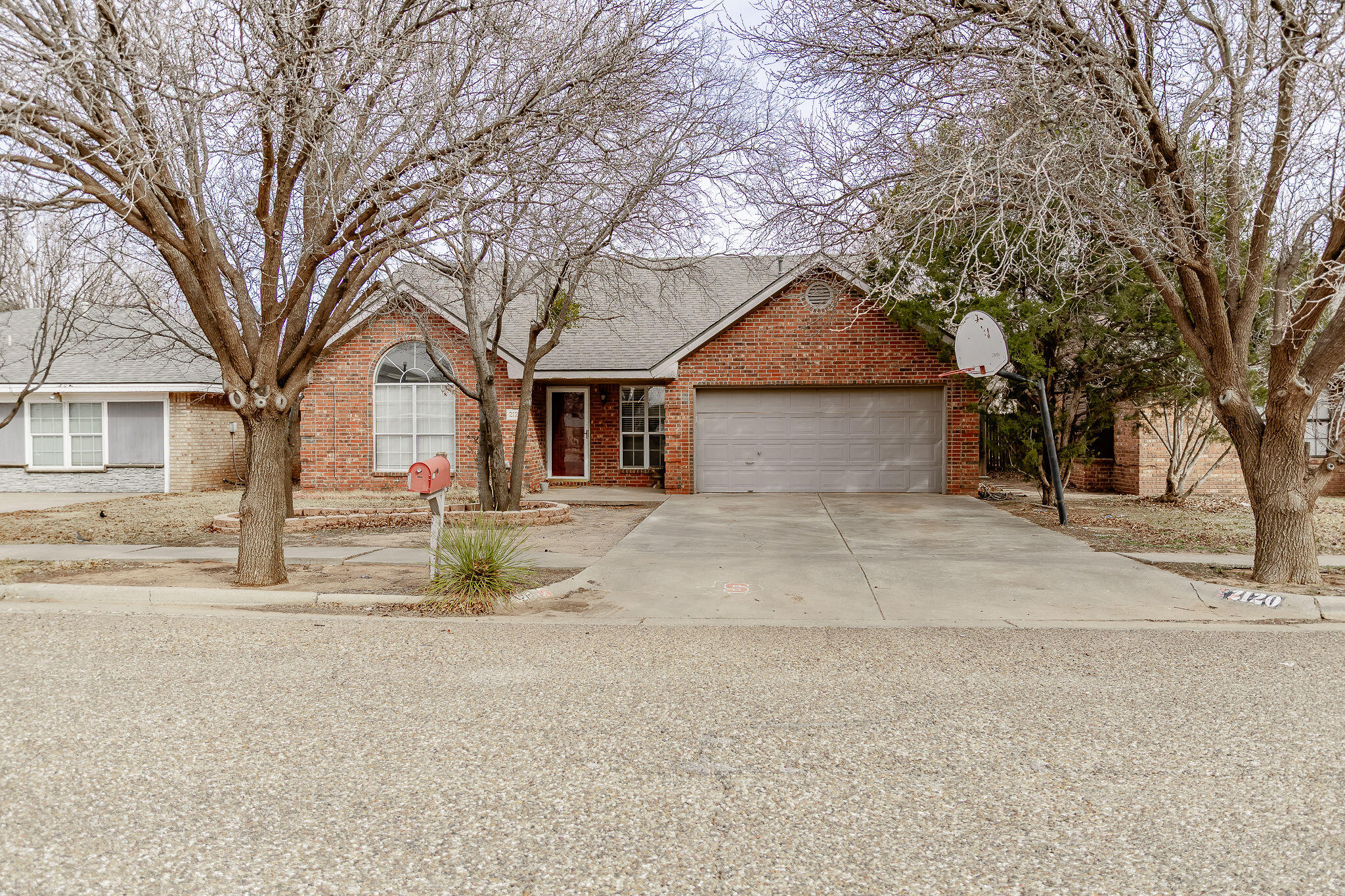 2120 93rd Street Lubbock, TX 79423 - Photo 1 of 32 front view of a house with a dry yard