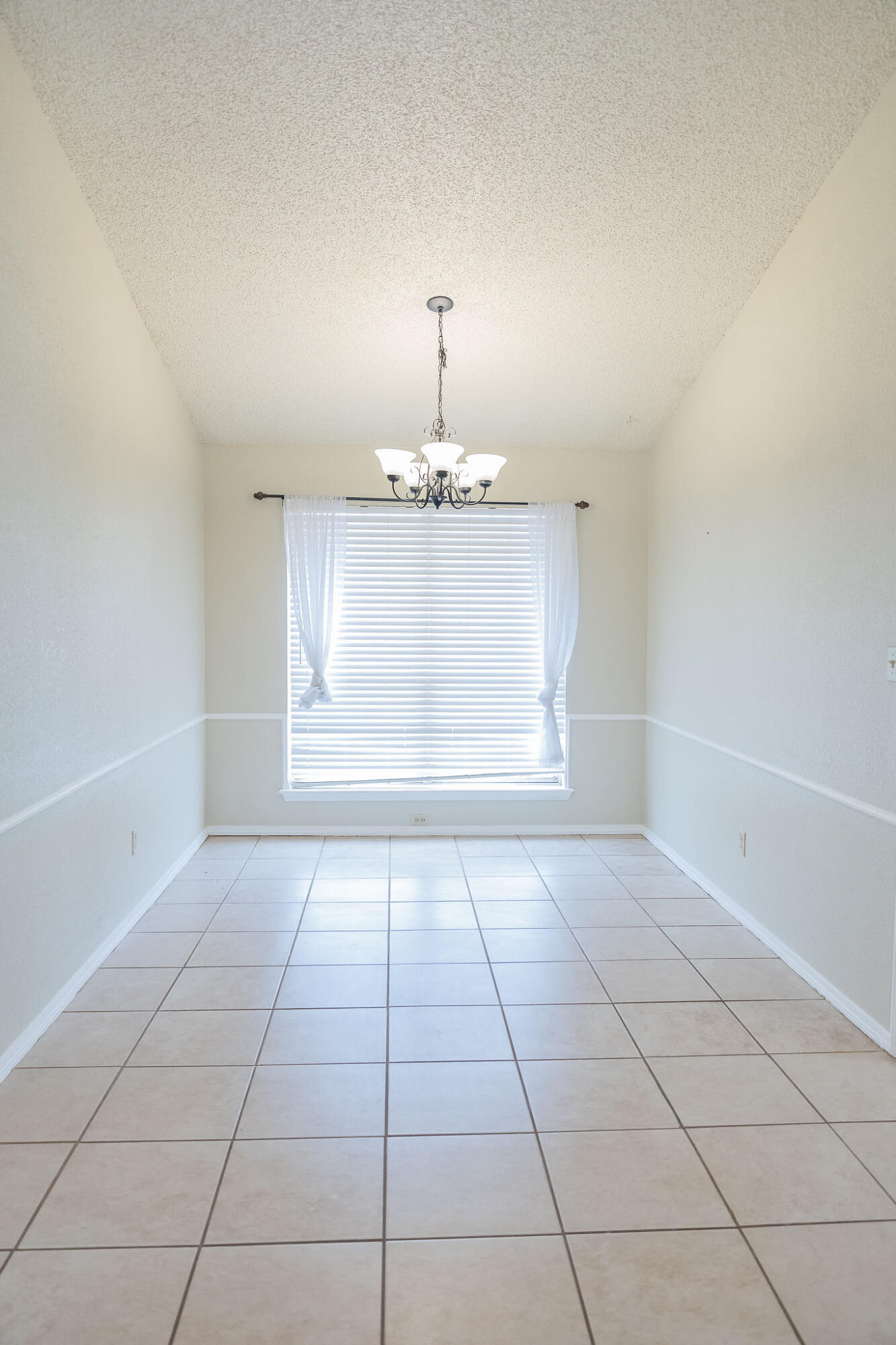 2120 93rd Street Lubbock, TX 79423 - Photo 15 of 32 a view of an empty room with a window