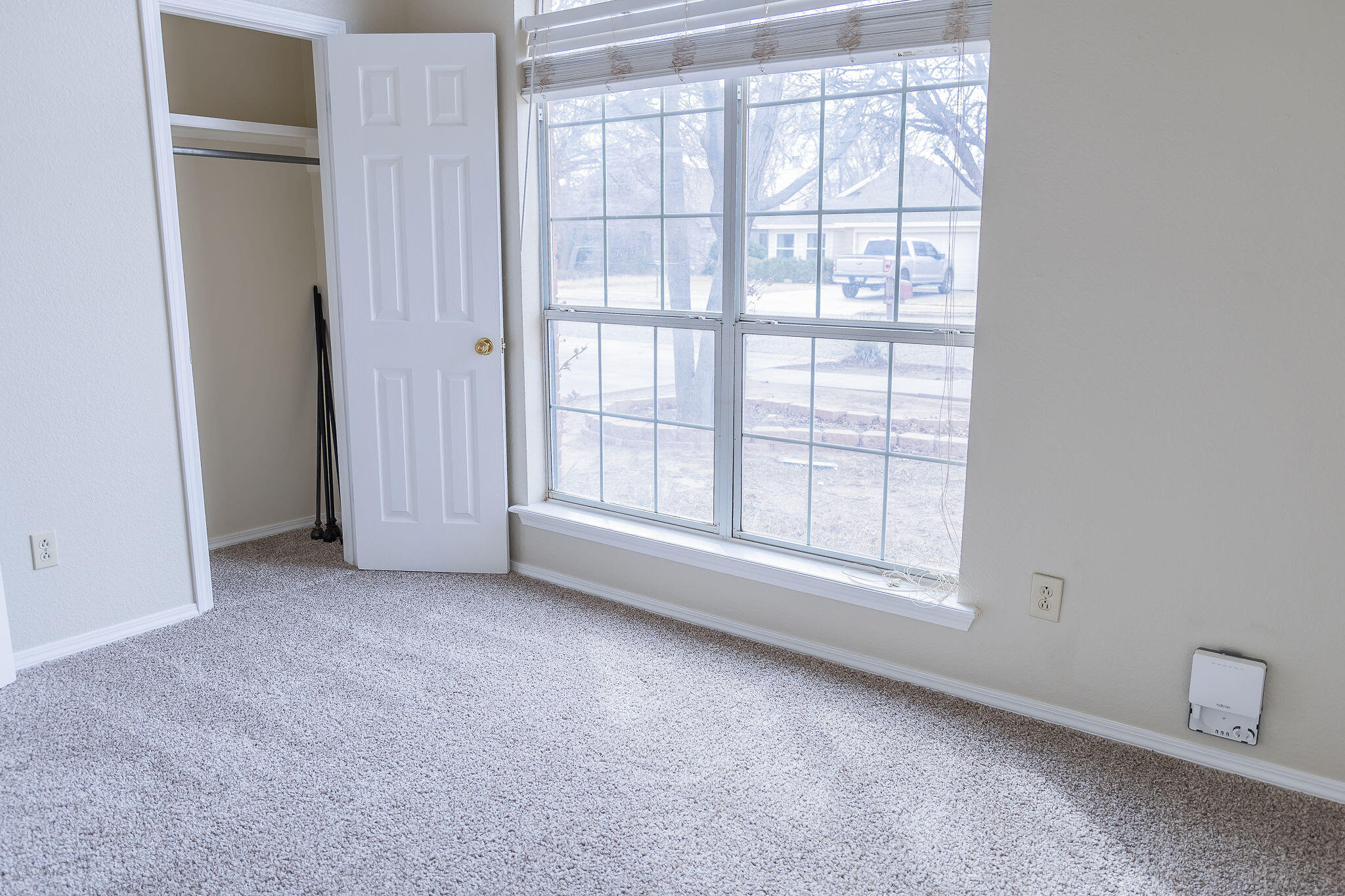 2120 93rd Street Lubbock, TX 79423 - Photo 20 of 32 an empty room with windows