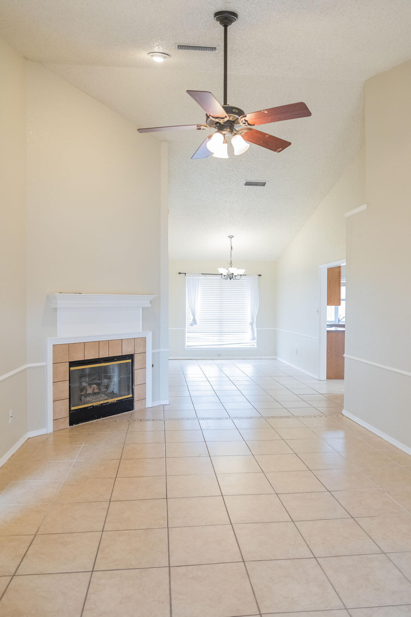 2120 93rd Street Lubbock, TX 79423 - Photo 2 of 32 a view of an empty room and fire place