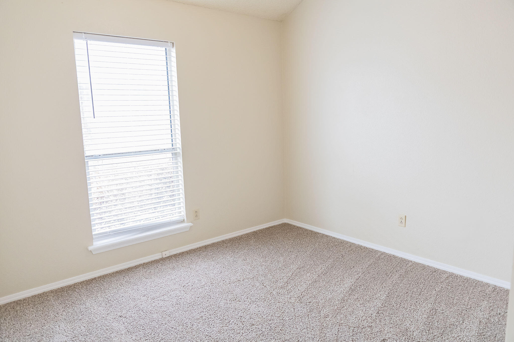 2120 93rd Street Lubbock, TX 79423 - Photo 23 of 32 an empty room with a window