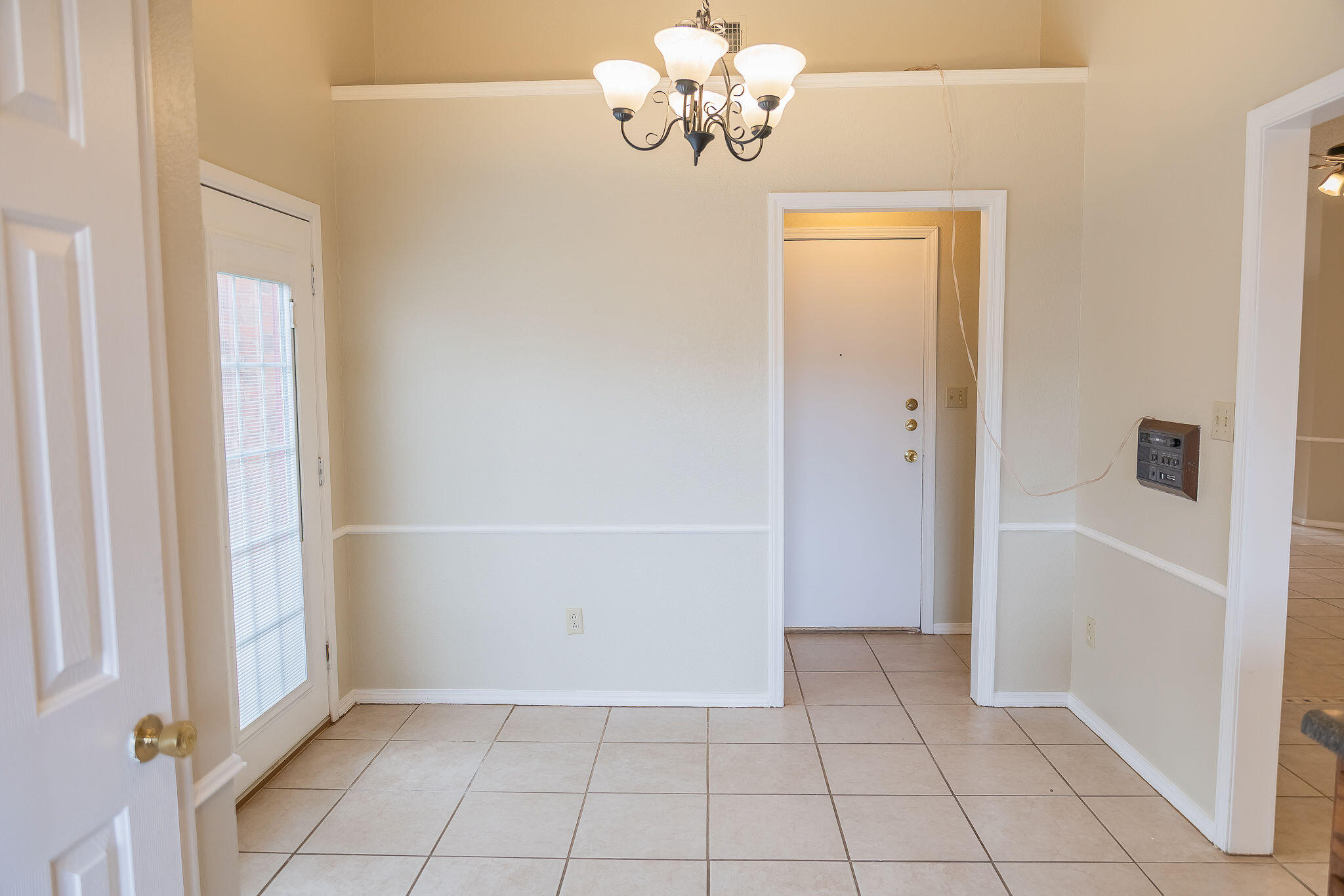 2120 93rd Street Lubbock, TX 79423 - Photo 27 of 32 a view of an empty room with a window