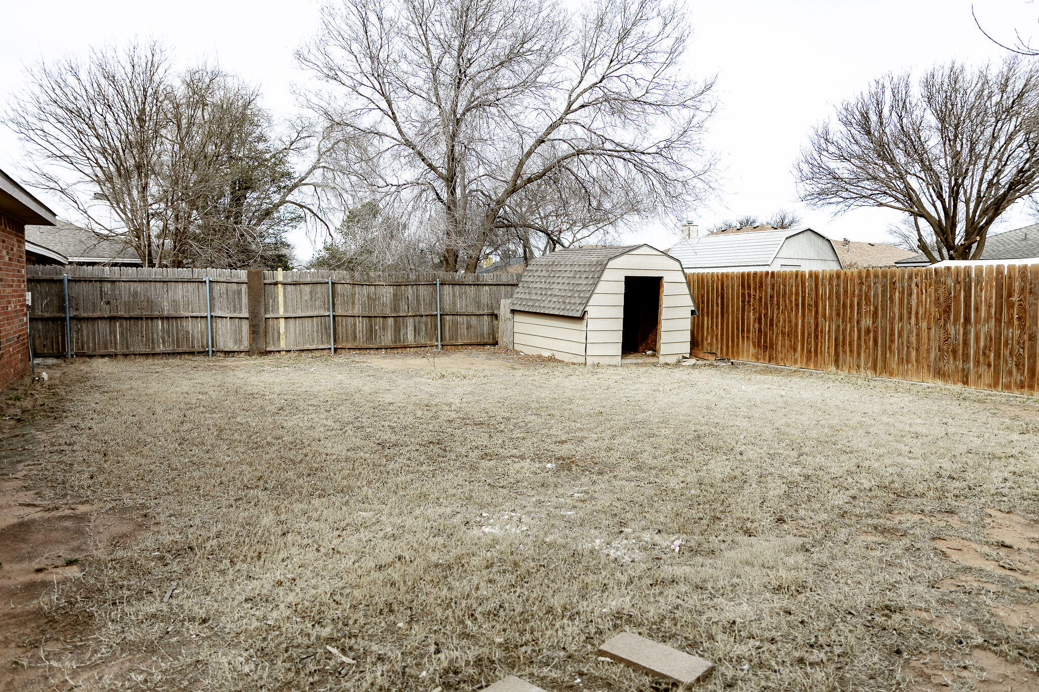 2120 93rd Street Lubbock, TX 79423 - Photo 30 of 32 a view of a backyard