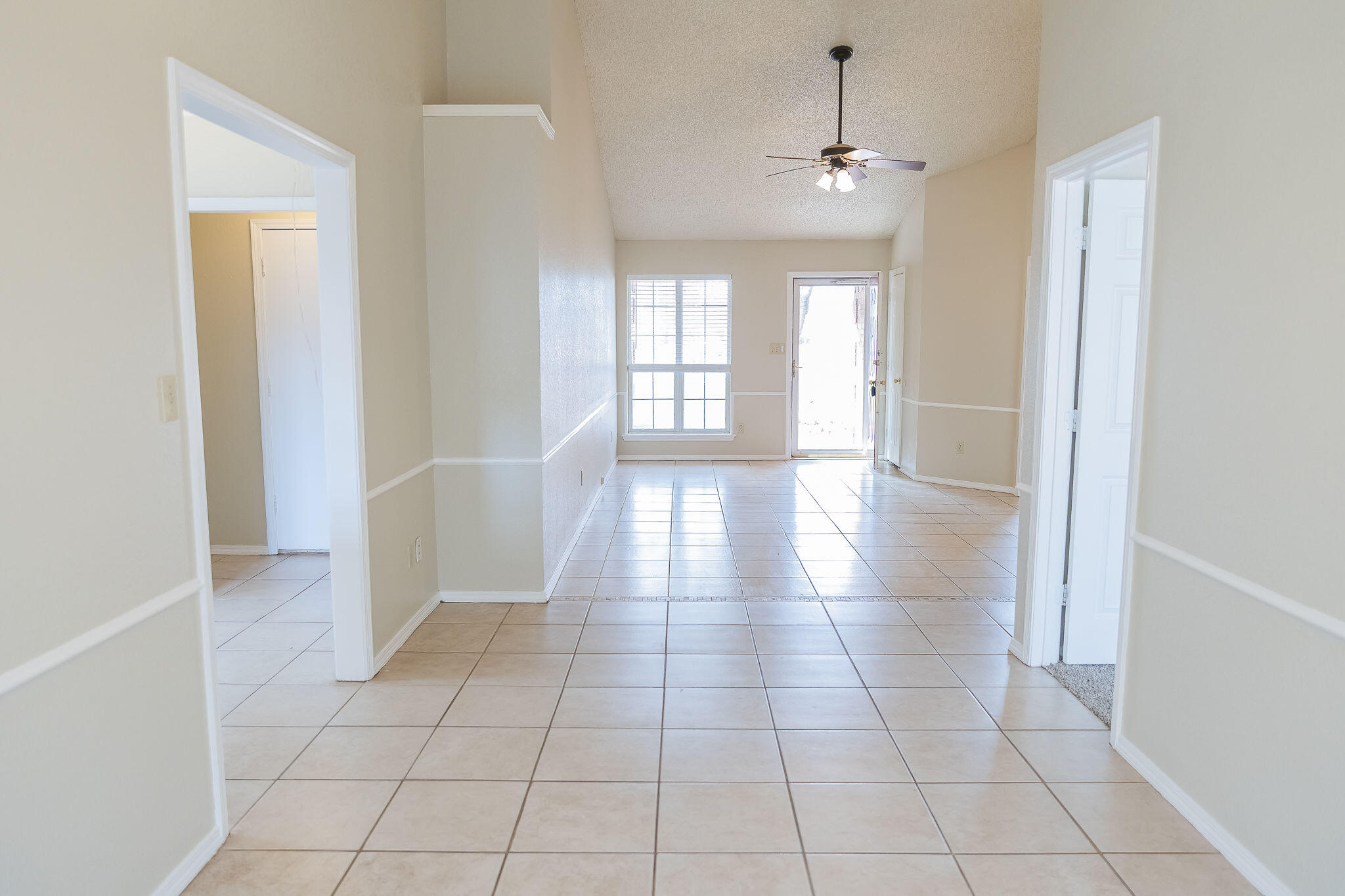 2120 93rd Street Lubbock, TX 79423 - Photo 3 of 32 a view of an empty room and window