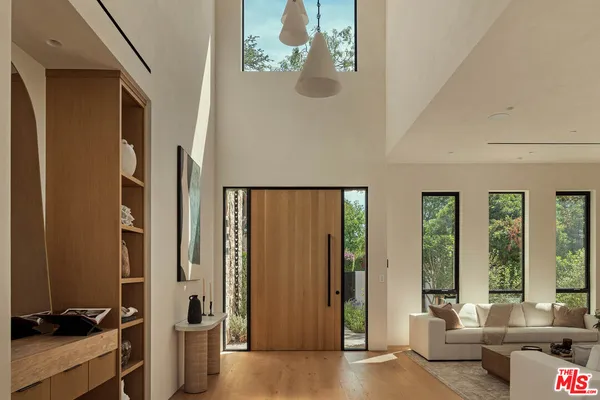 a view of a livingroom with furniture and windows