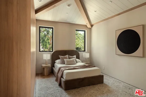 a bedroom with a bed and window