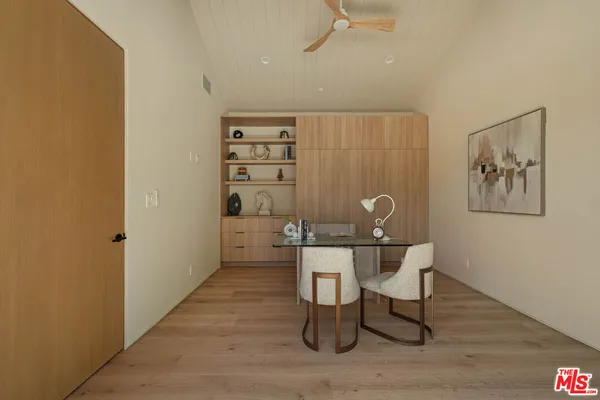 a workspace with furniture and wooden floor