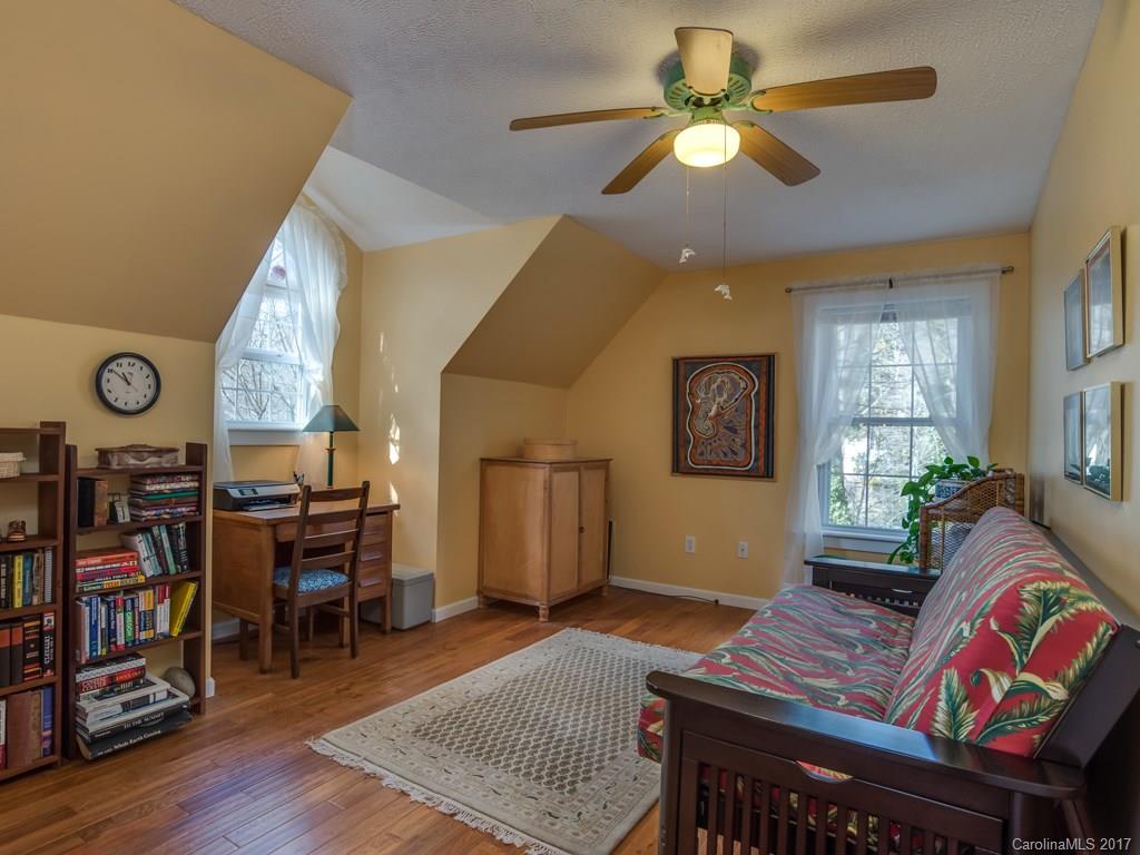 2129 Locust Grove Road, Unit 8 Hendersonville, NC 28792 - Photo 14 of 24 a living room with furniture and a window