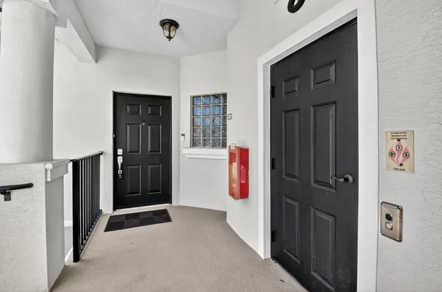 view of a living room with furniture and a chandelier