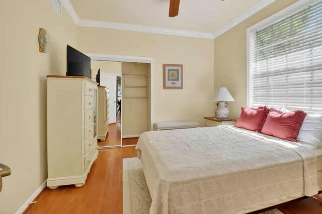 a bedroom with a bed and a cabinets