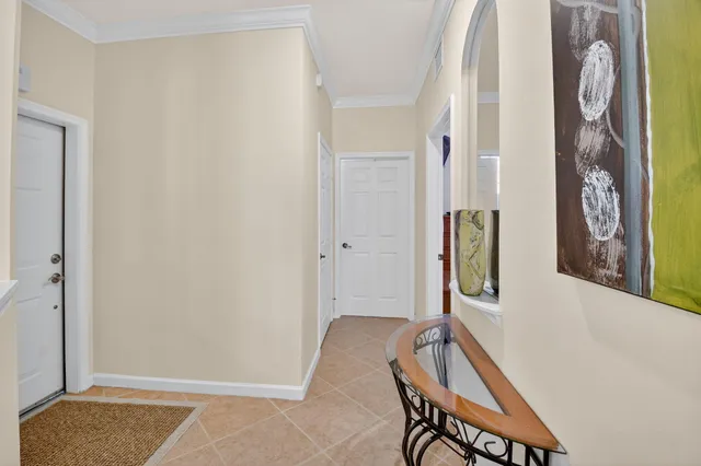 a kitchen with kitchen island granite countertop wooden cabinets a stove a sink a dining table and chairs