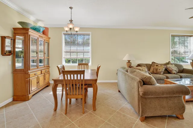 a view of a dining room with furniture window and outside view