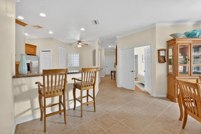 a dining room with furniture and window