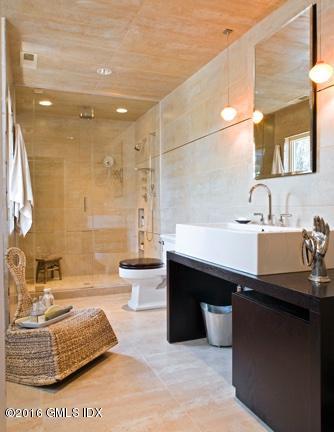 62 Arch Street Riverside, CT 06878 - Photo 12 of 16 a bathroom with a sink double vanity and a mirror