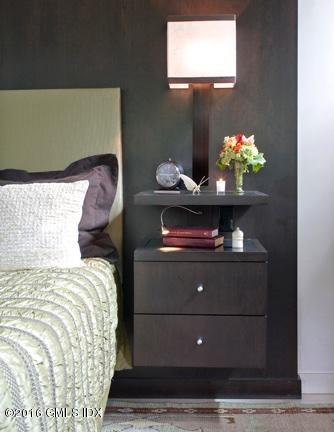 62 Arch Street Riverside, CT 06878 - Photo 16 of 16 a bed sitting in a bedroom next to a window