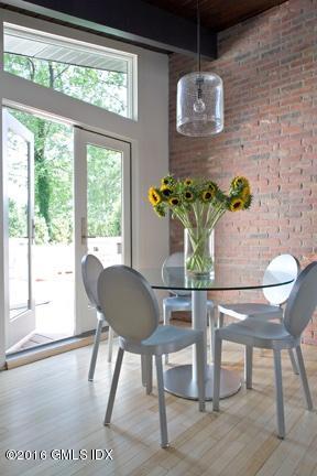 62 Arch Street Riverside, CT 06878 - Photo 3 of 16 a view of a dining room with furniture window and wooden floor