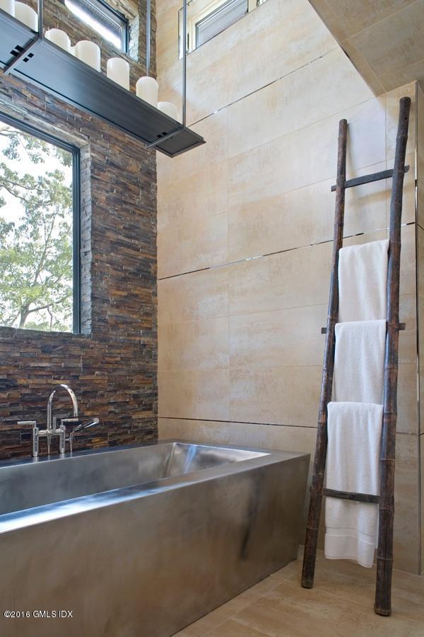 62 Arch Street Riverside, CT 06878 - Photo 7 of 16 a view of a bath tub sitting in a bathroom