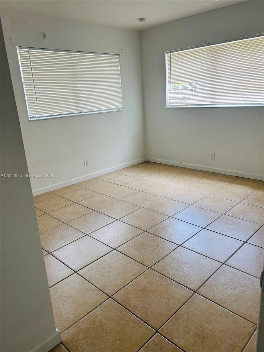 412 Southwest 10th Street, Unit 12 Hallandale Beach, FL 33009 - Photo 7 of 11 a view of a garage