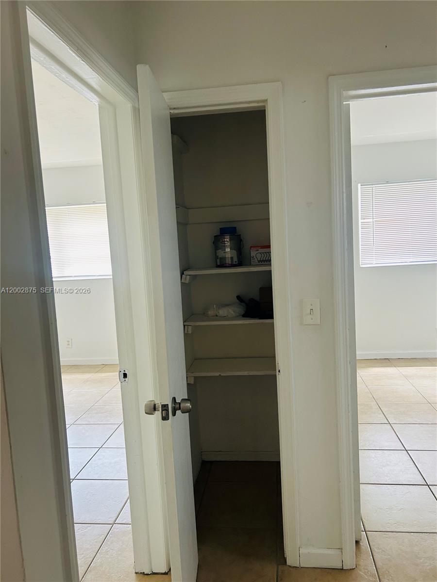 412 Southwest 10th Street, Unit 12 Hallandale Beach, FL 33009 - Photo 8 of 11 a view of walk in closet