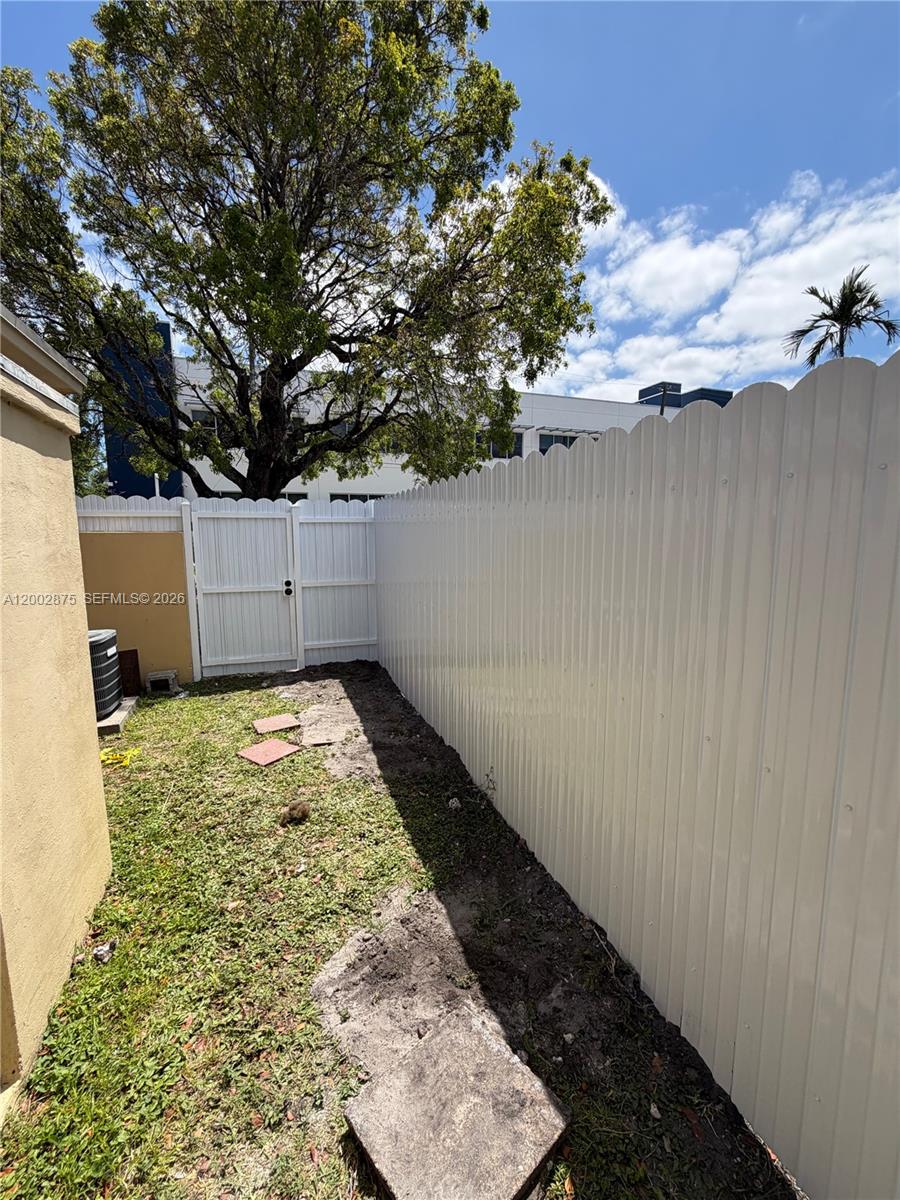 412 Southwest 10th Street, Unit 12 Hallandale Beach, FL 33009 - Photo 9 of 11 a view of a backyard