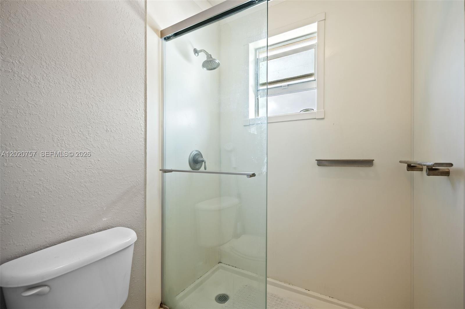 255 East 3rd Street, Unit 1 Hialeah, FL 33010 - Photo 18 of 38 a bathroom with a shower a toilet and sink