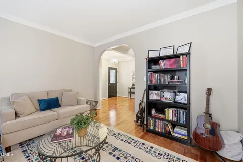 a living room with furniture a book shelf and a book shelf