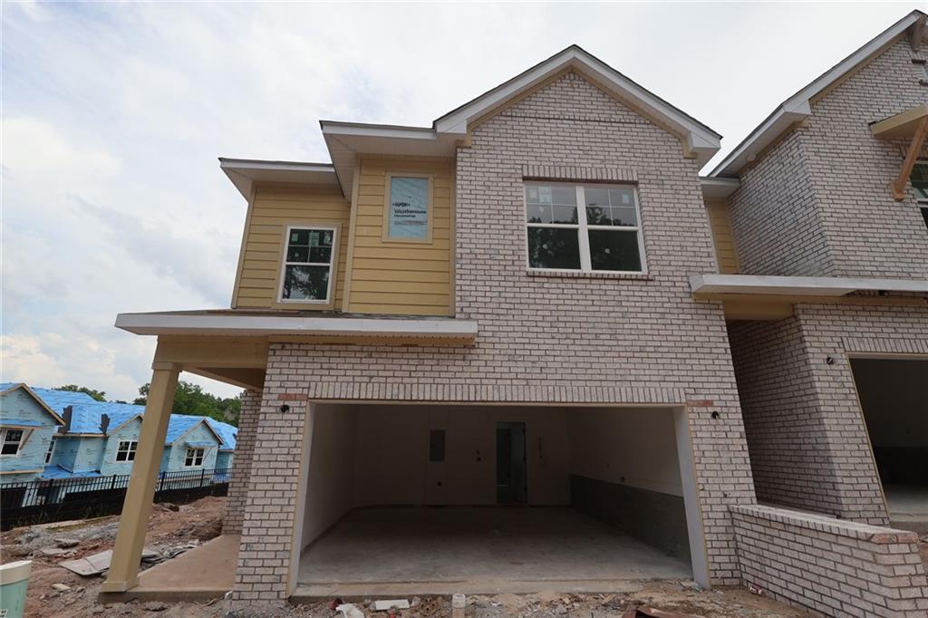 230 Redbud Road Canton, GA 30114 - Photo 2 of 11 a front view of a house with a garage