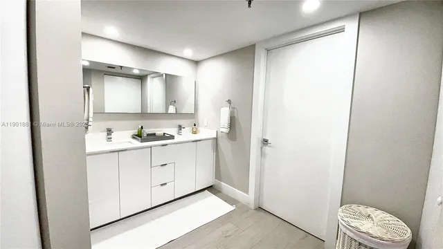 a bathroom with a sink and a mirror