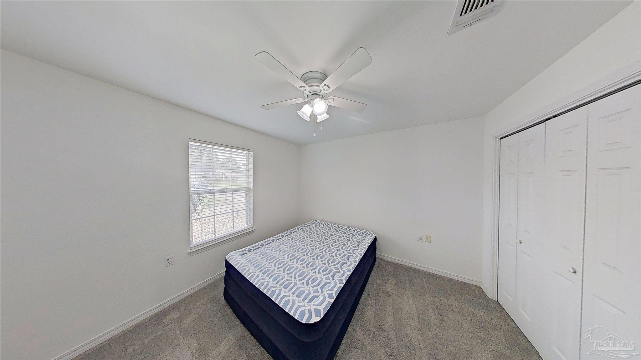 1039 Brownfield Road Pensacola, FL 32526 - Photo 12 of 14 a view of an empty room and window