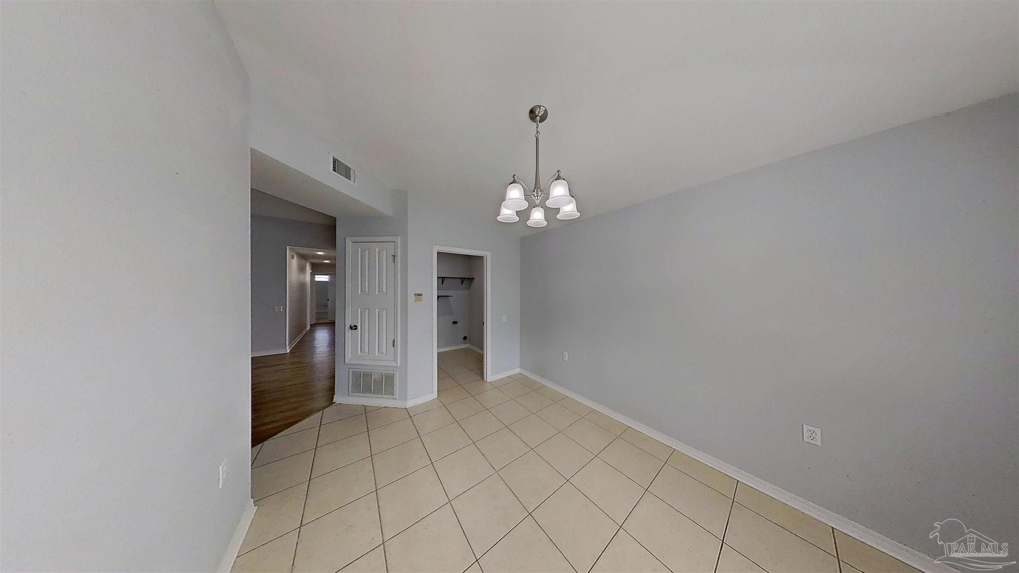 1039 Brownfield Road Pensacola, FL 32526 - Photo 5 of 14 a view of a hallway with chandelier and entryway