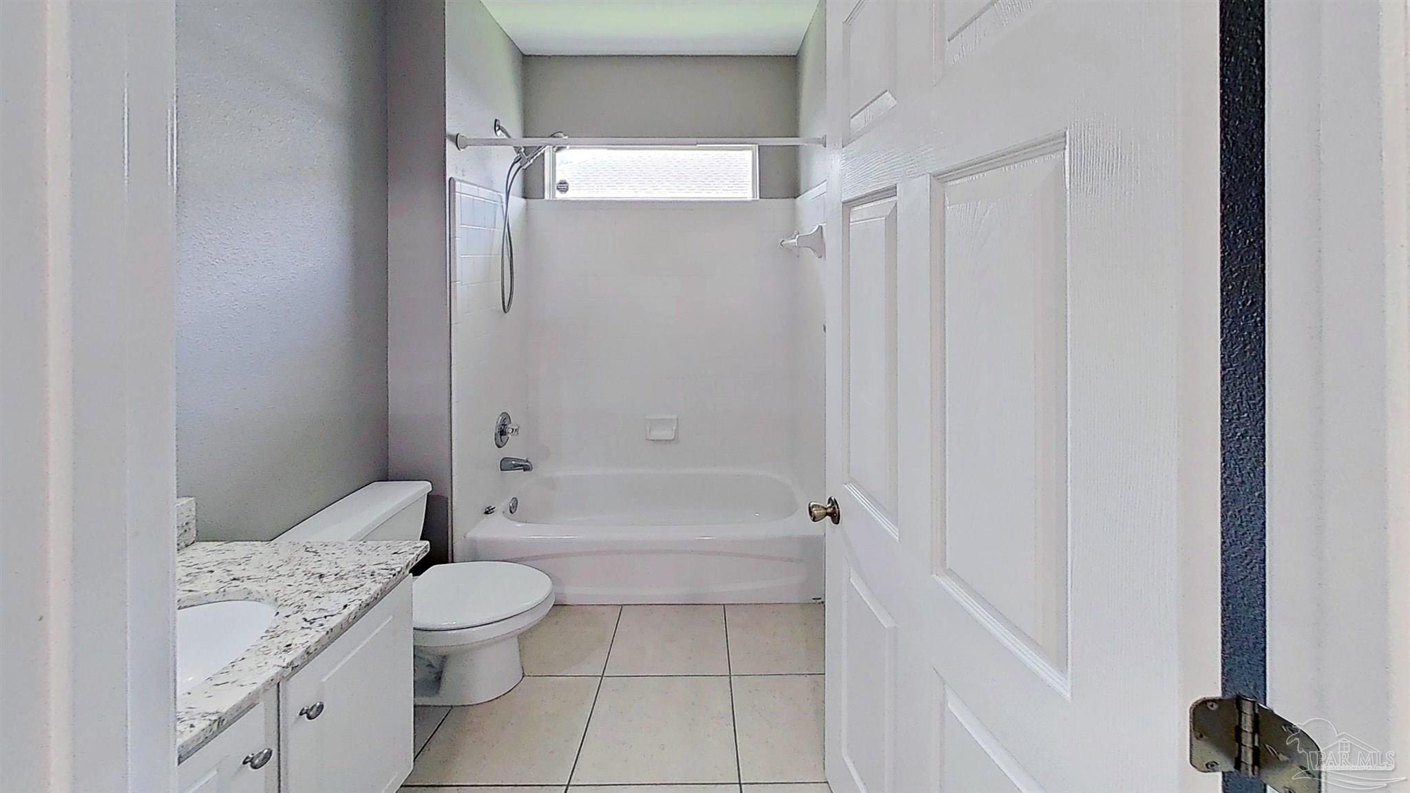 1039 Brownfield Road Pensacola, FL 32526 - Photo 8 of 14 a bathroom with a bathtub toilet and a shower