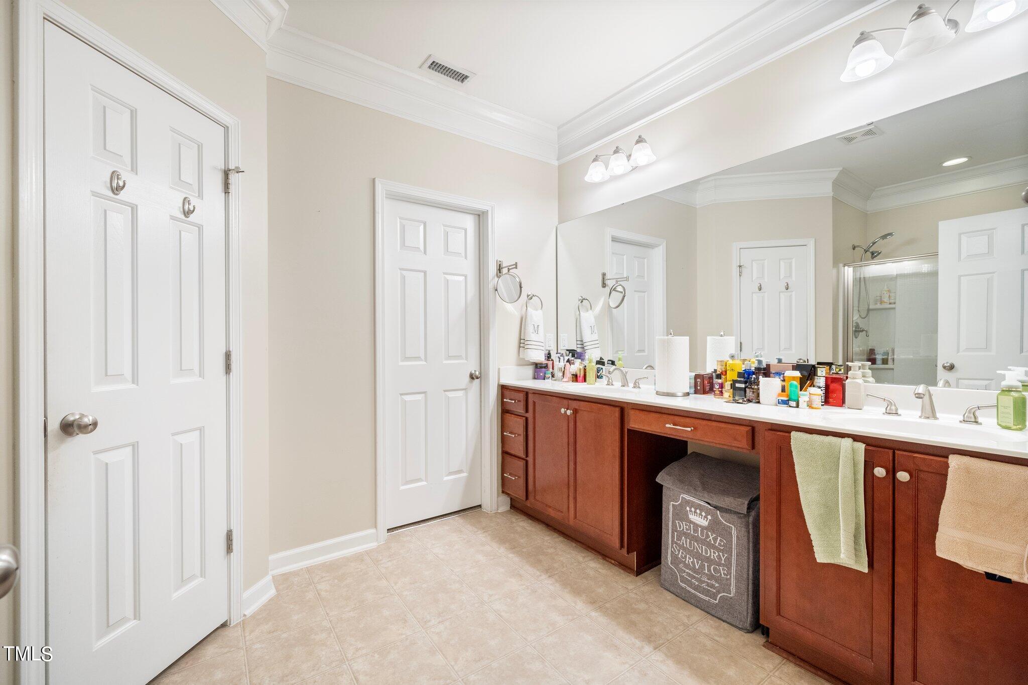 903 Ambergate Station Apex, NC 27502 - Photo 13 of 24 a room with stainless steel appliances lots of wooden furniture
