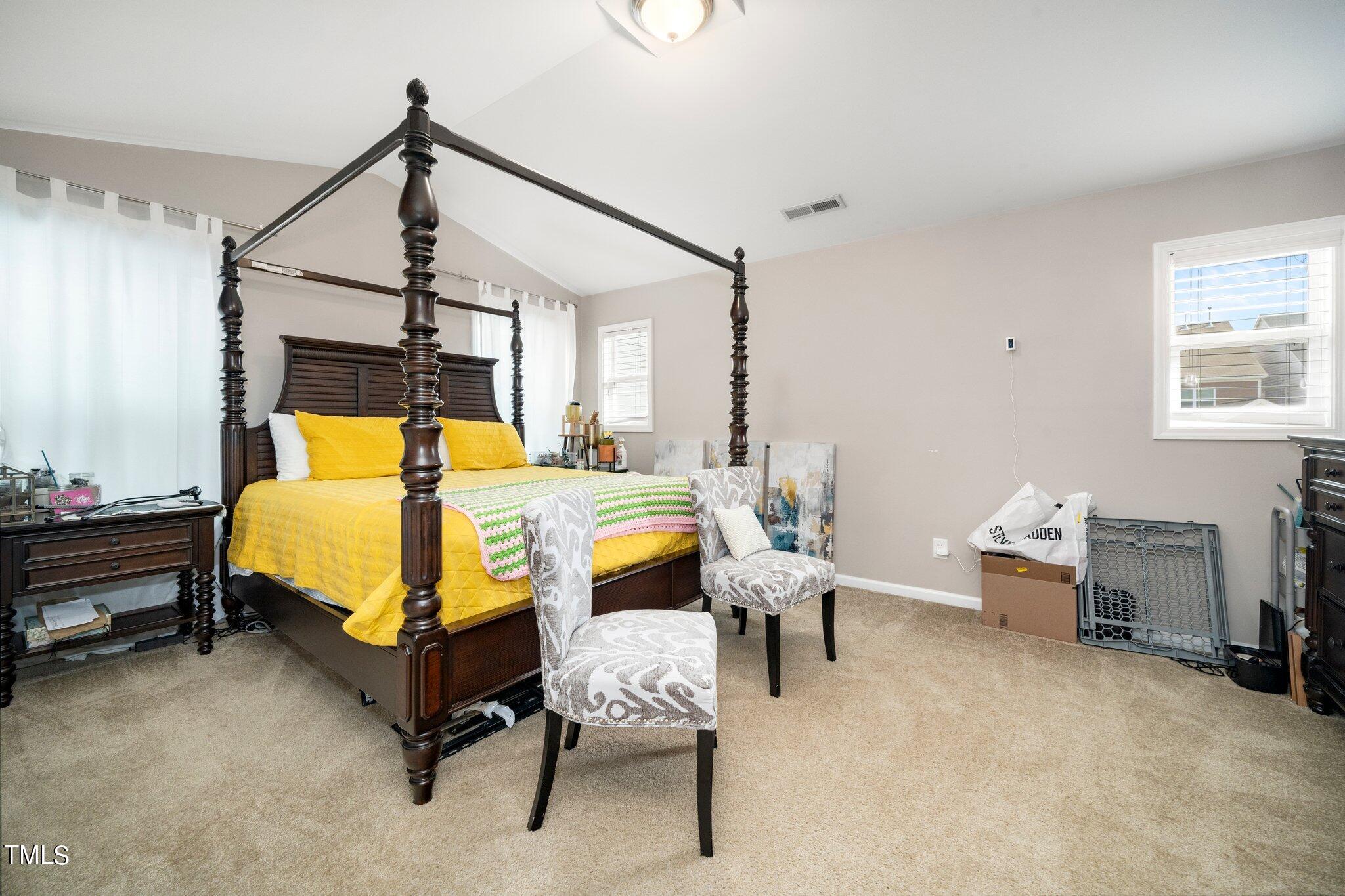 903 Ambergate Station Apex, NC 27502 - Photo 18 of 24 a bedroom with a bed and window