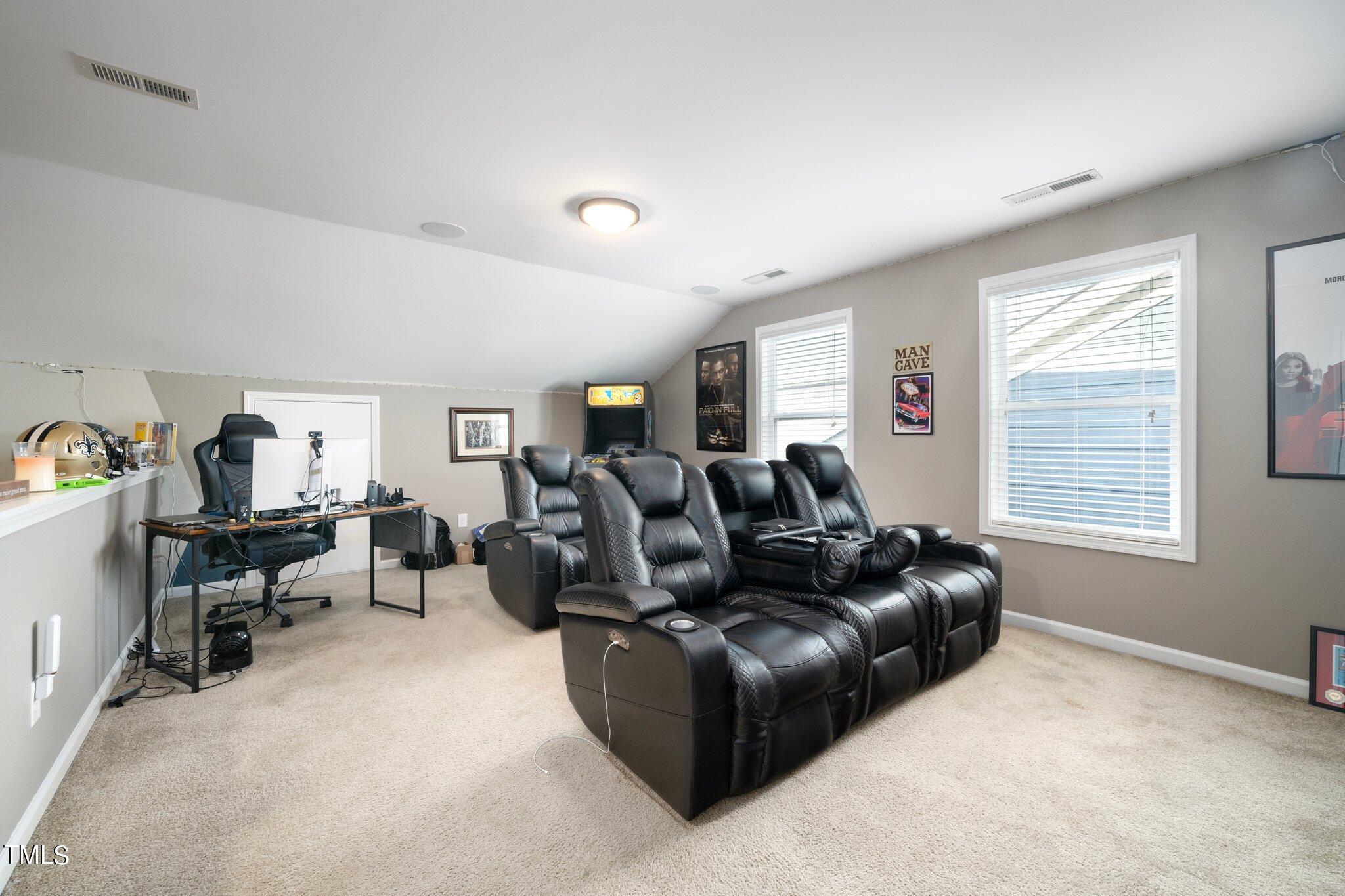 903 Ambergate Station Apex, NC 27502 - Photo 20 of 24 a living room with furniture and a window