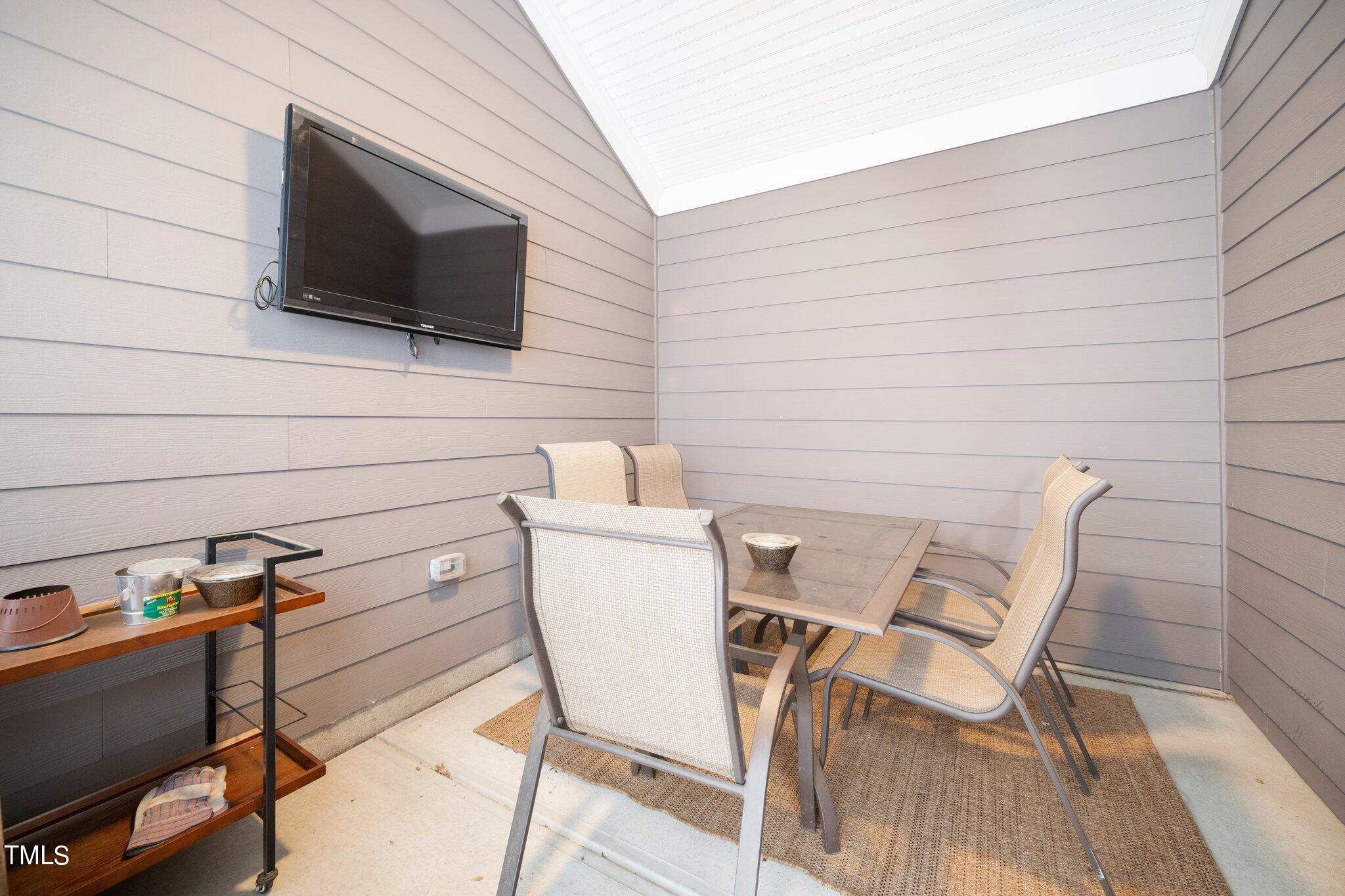 903 Ambergate Station Apex, NC 27502 - Photo 21 of 24 a view of a chairs and table in a patio